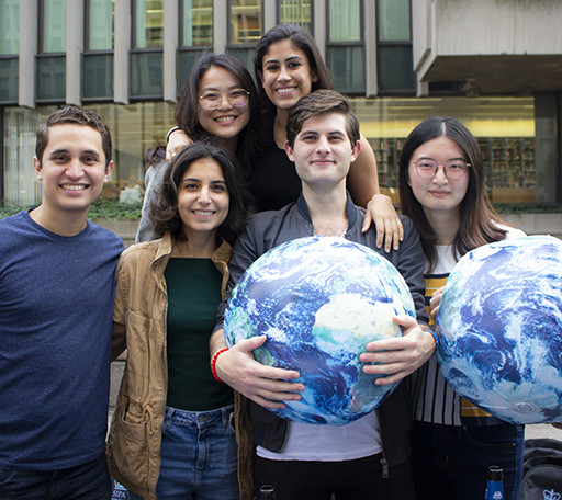 Students with inflatable globes